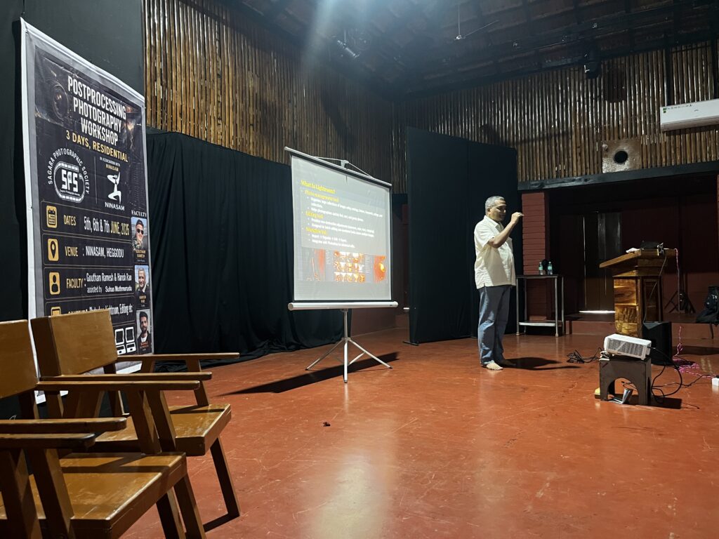 A presenter explaining Lightroom during the SPS post-processing workshop at Ninasam.